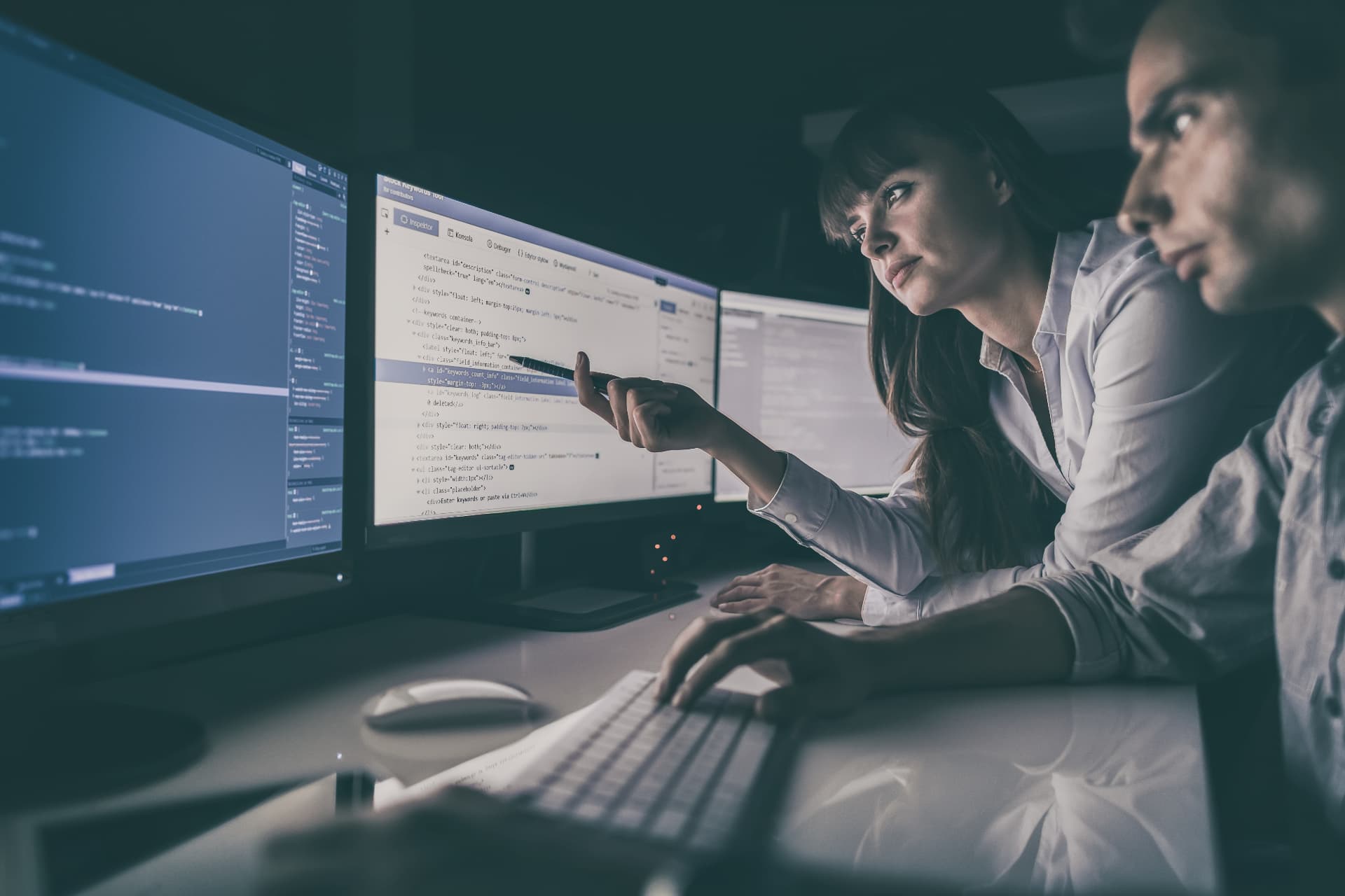 Energy analysts reviewing live monitoring data on screen